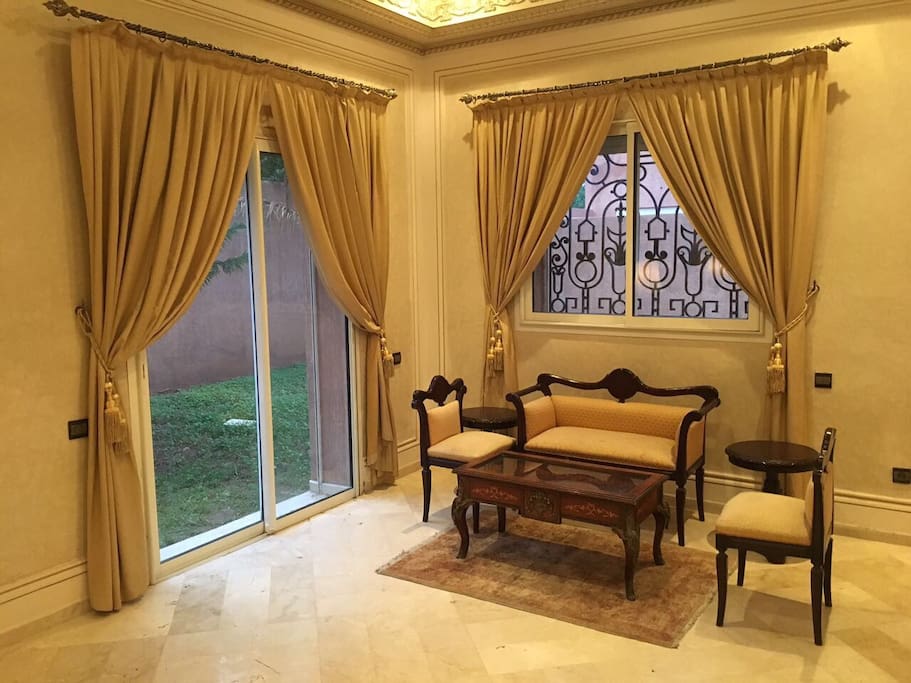 Sitting area in living room, view of garden
