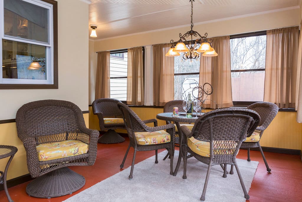 In warmer months, enjoy the large, enclosed three-season front porch.