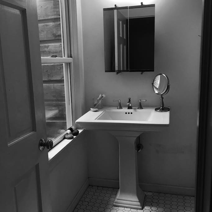 Vintage bathroom with modern jacuzzi tub.