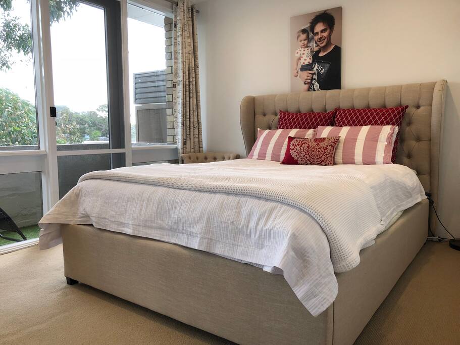 The main bedroom has a brand new french style queen bed & brand new mattress. It opens up onto the west balcony.