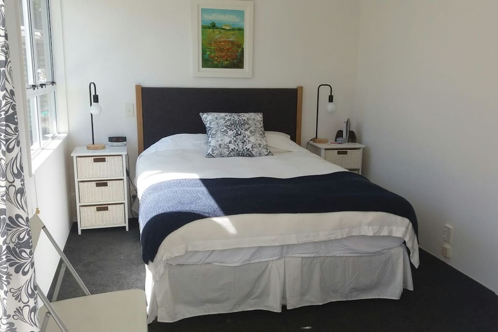 Spacious double room with queen size bed in your private room, opens out thro' double doors to a lovely deck and pretty garden.