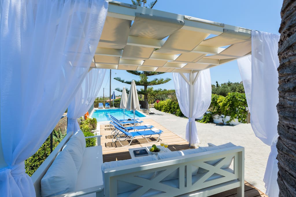 Comfortable outdoor seating area by the pool
