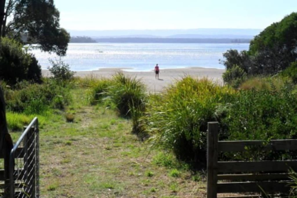 meters from the water-photo taken from the back gate of Sandpiper Beach House