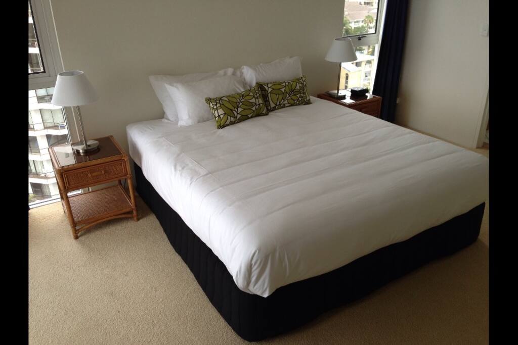 King size bed, walk in robe and wall mounted tv.