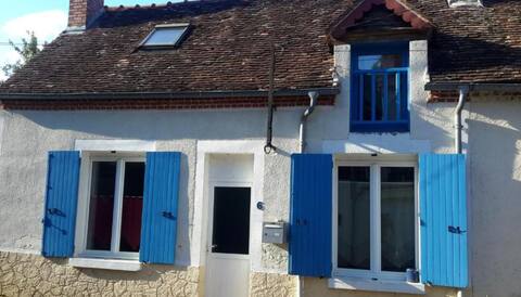 Small house with blue shutters