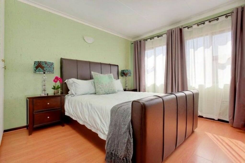 Upstairs Bedroom with entrance to top balcony