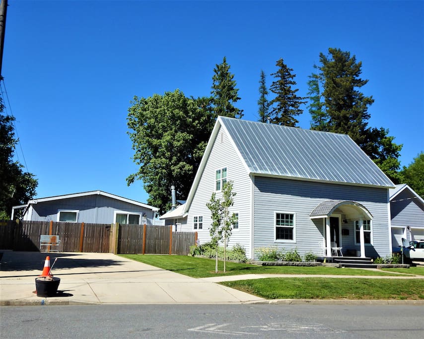 Vacation home is on the left with guests' extra large private driveway and the hosts' Historic 1902 home is on the right