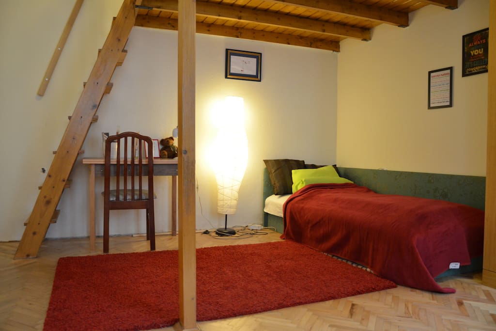 Single bed under the galery