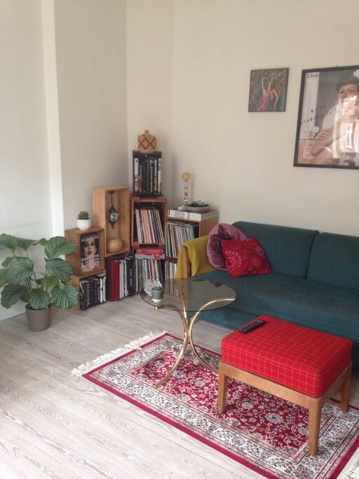 Livingroom with couch, that can be used as a bed for two.