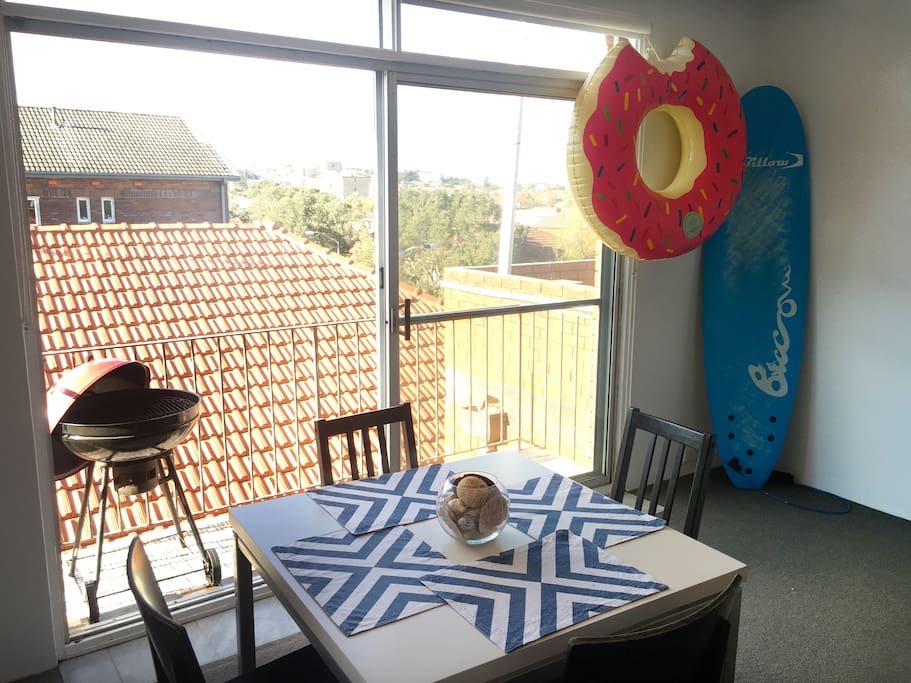 Dining area and balcony with BBQ.