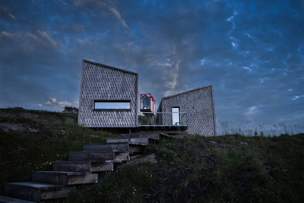 View of the studio, kitchen and tower on a stormy night