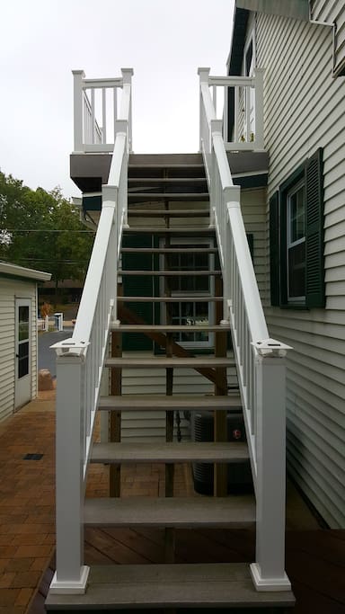 Stairs to private balcony & entrance.
