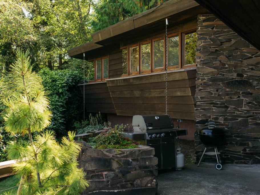We have both propane and charcoal grill options. View of cabin windows which face the water.