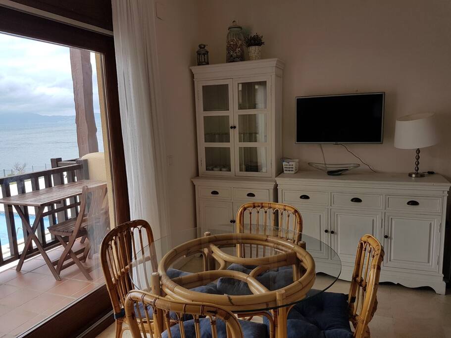 New TV in the dining room. Unbelievable views while eating. Living room with air conditioning. Wifi is now on the house !!