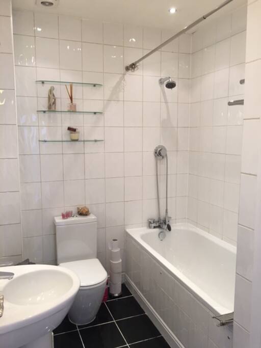 Clean and bright bathroom with bathrobes