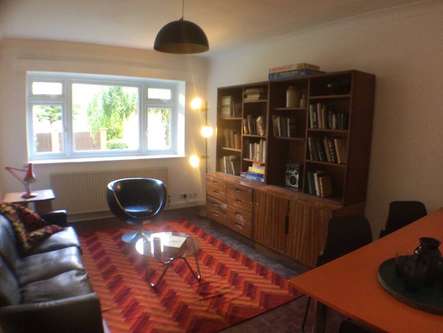 Living room with view of leafy back garden/yard