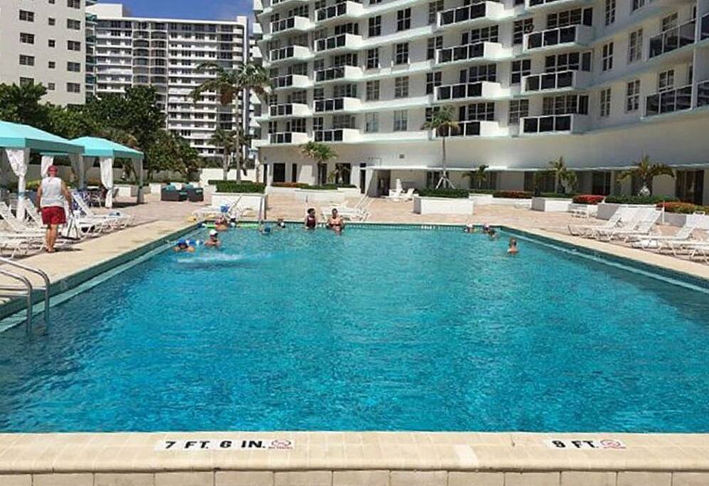 beautiful heated pool and covered cabanas