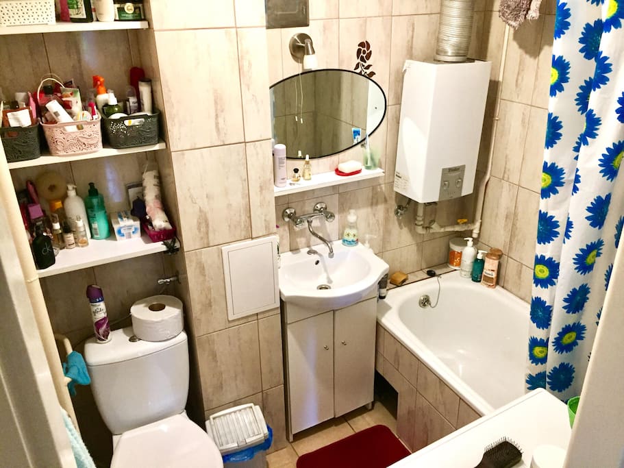 clean bathroom with cleaning supplies