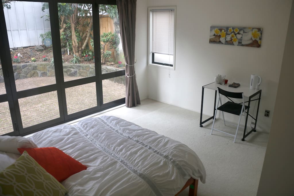 Large bedroom, with double bed and built in wardrobe. Private courtyard.