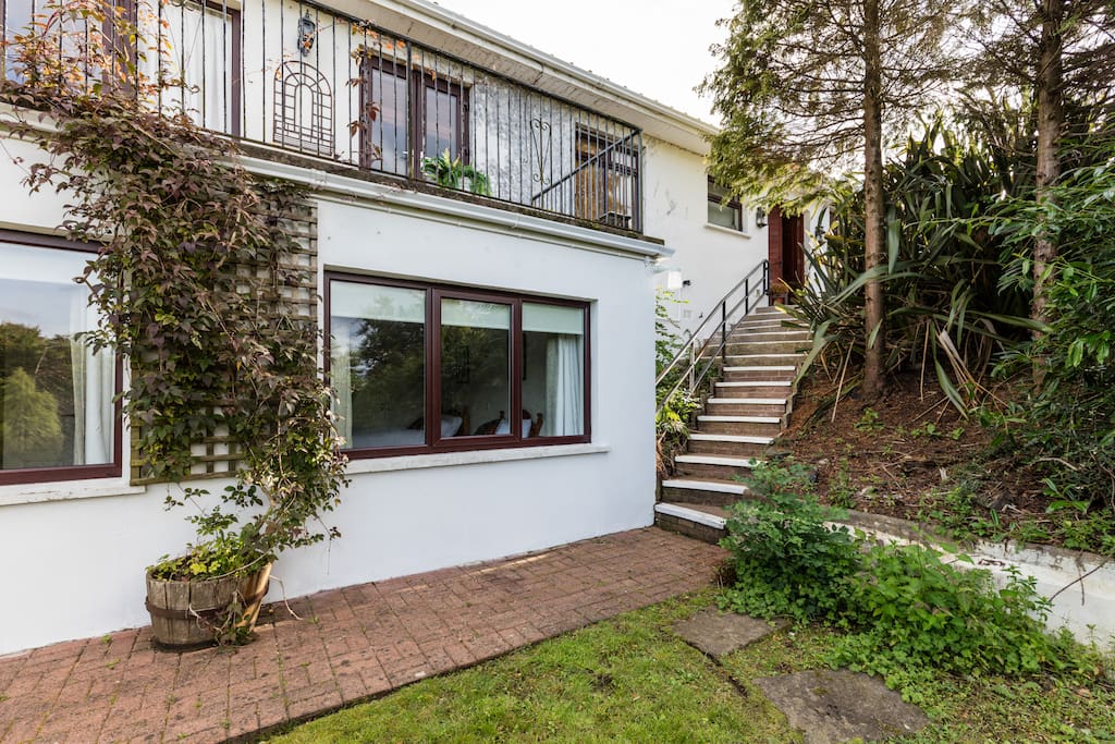 The downstairs bedroom and steps to parking