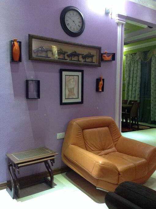 Single seater with background wall decor of Arabic-Swahili wall decor