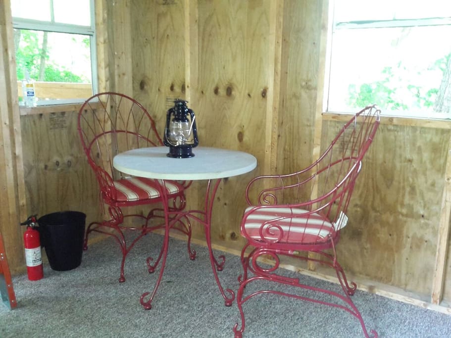 Small table inside. Picnic table outside.