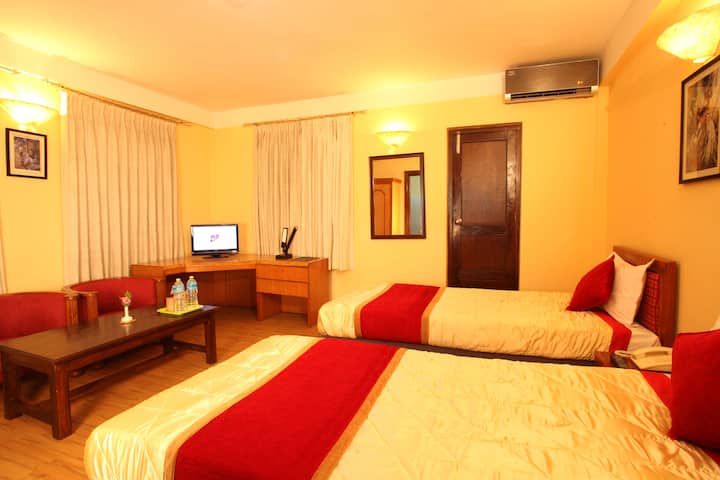 Chambre de luxe avec lits jumeaux