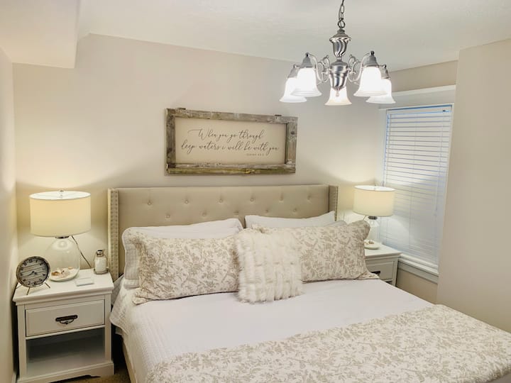 First guest bedroom on ground floor with king bed, premium mattress and bedding. Night stands lamps, and closet. (Closet includes twin air mattress to use as needed) 