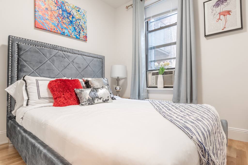 2nd Master Bedroom featuring luxury SoHo Design Queen Sized Bed. New Amazing Mattress and plush new bedding with high attention to detail to artwork and accents