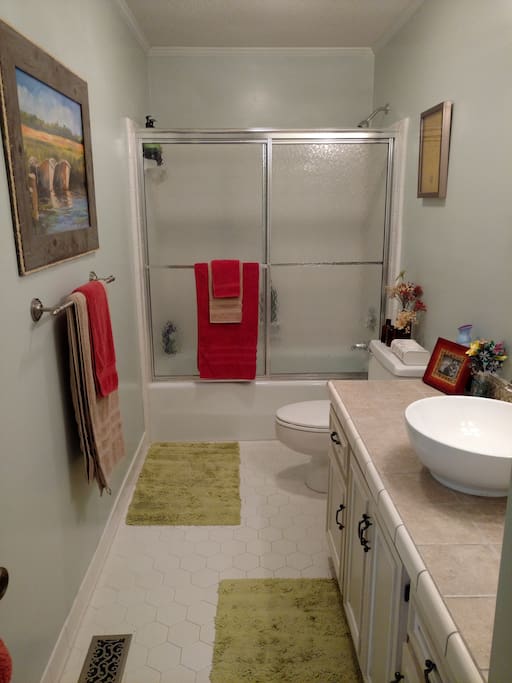 Full private bath in guest wing, sits between Main Guest Bedroom and Extra Guest Bedroom