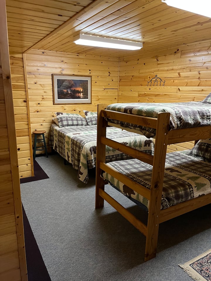 Downstairs bunk room with a queen bed