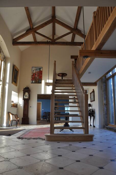 The oak staircase in the light-filled hall takes you to the bedrooms.