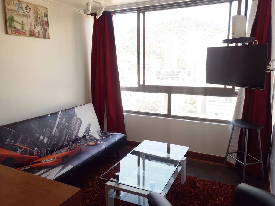 Living con sofa cama y TV