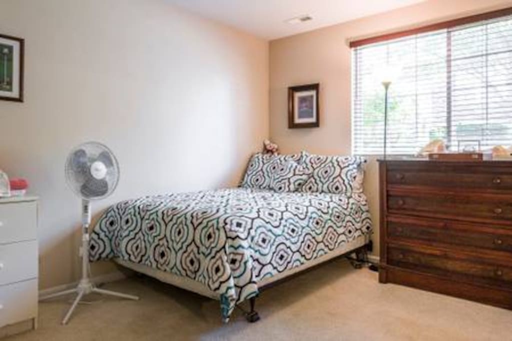 Private Bedroom: Private Full-size Bed; Chest of drawers; Stand-up fan; Nightstand; (Movable Cots not shown)