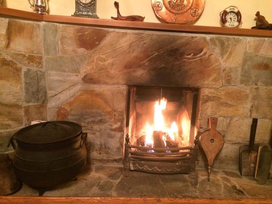 Turf fire, Achill stone hearth, bellows, and bog oak.