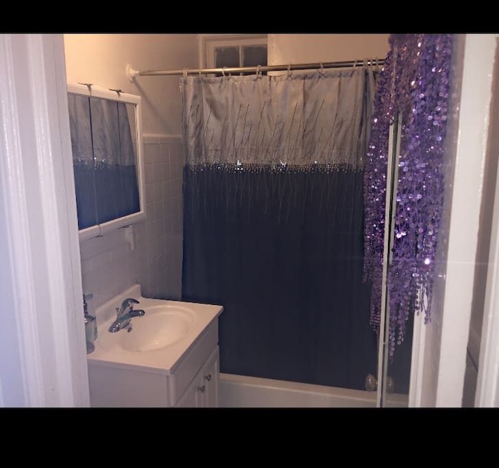 Bathroom with tub and shower