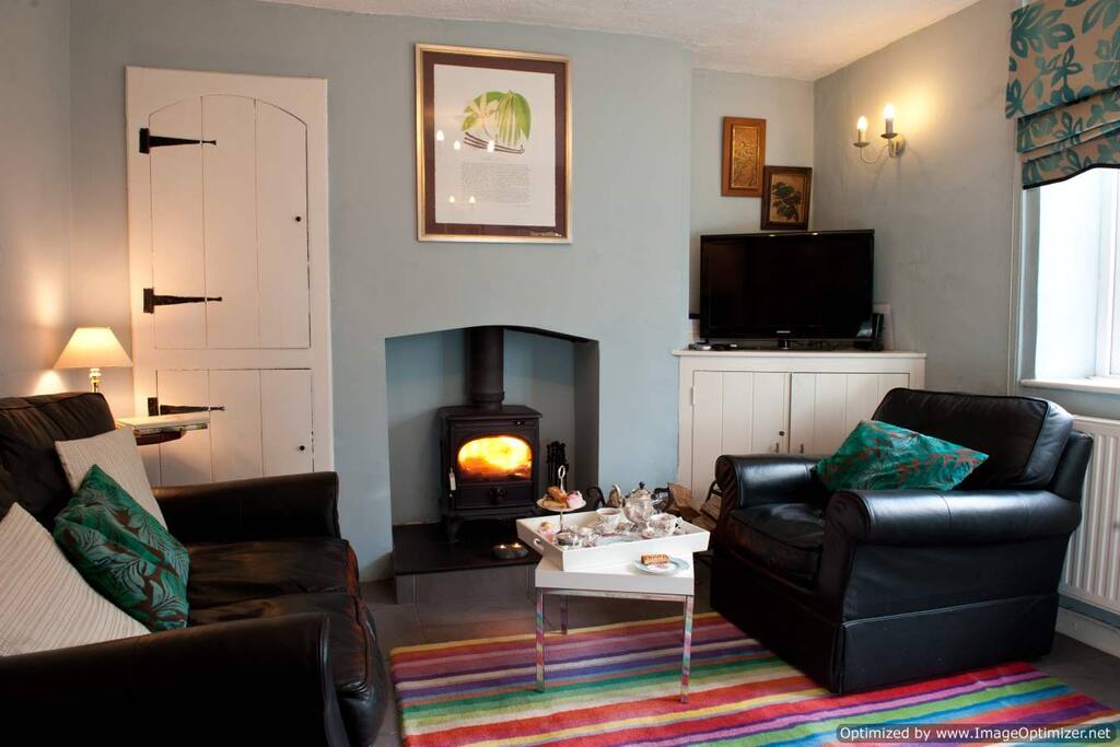 Cosy sitting room with woodburner and good quality TV