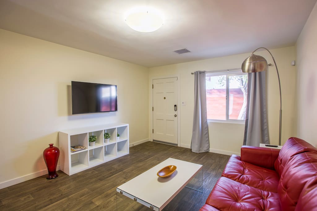 Flat screen wall mounted smart TV with Netflix and Hulu when you feel like relaxing at home.
