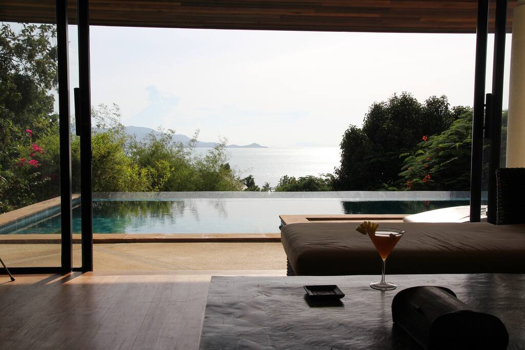 The living room looking out to the pool and the bay.