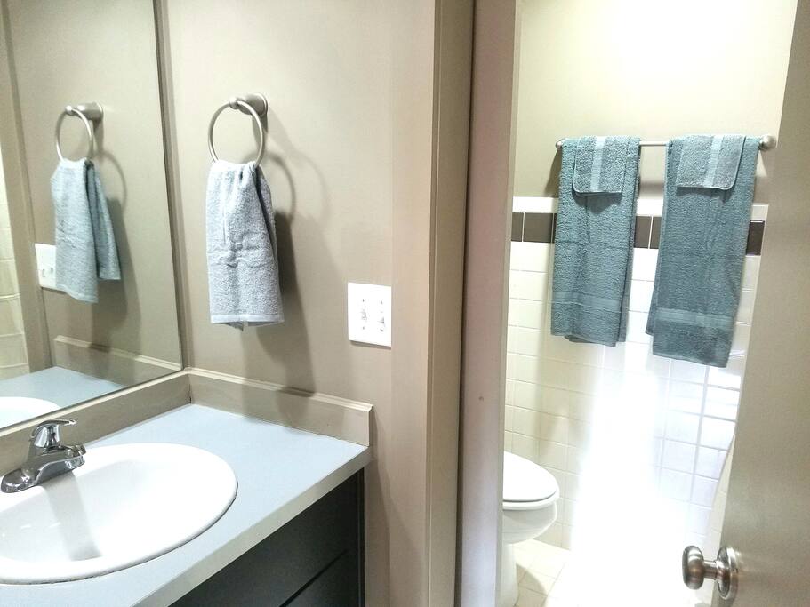 Bathroom has double vanities and separate shower/toilet room