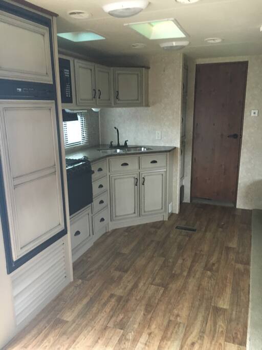 Spacious kitchen, completely stocked with cookware and dishes