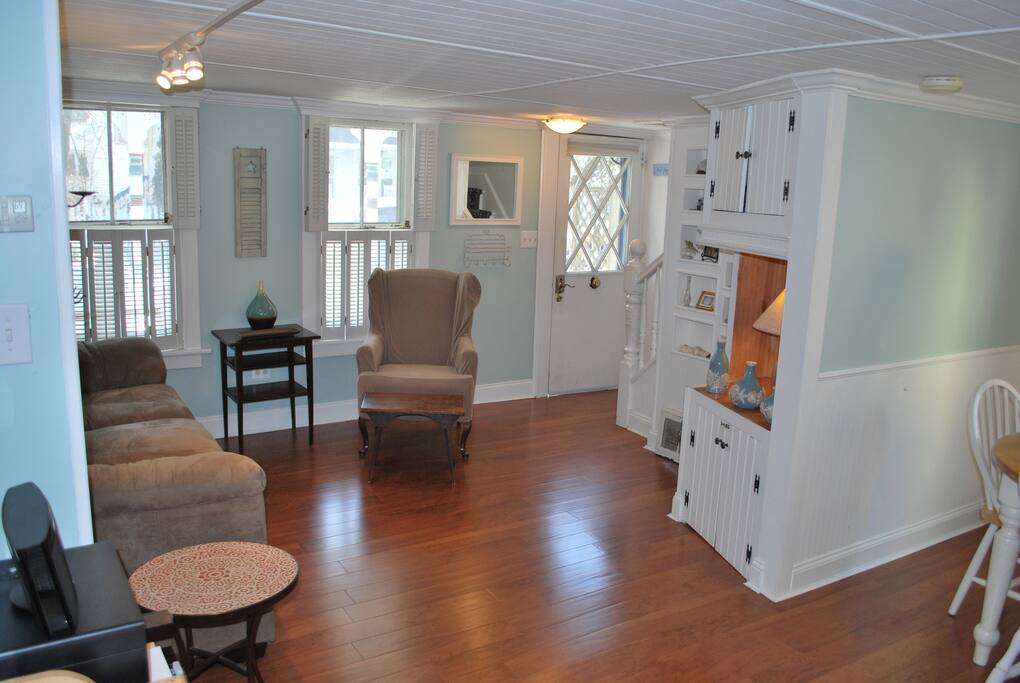 Charming, beach living room with open floor plan.