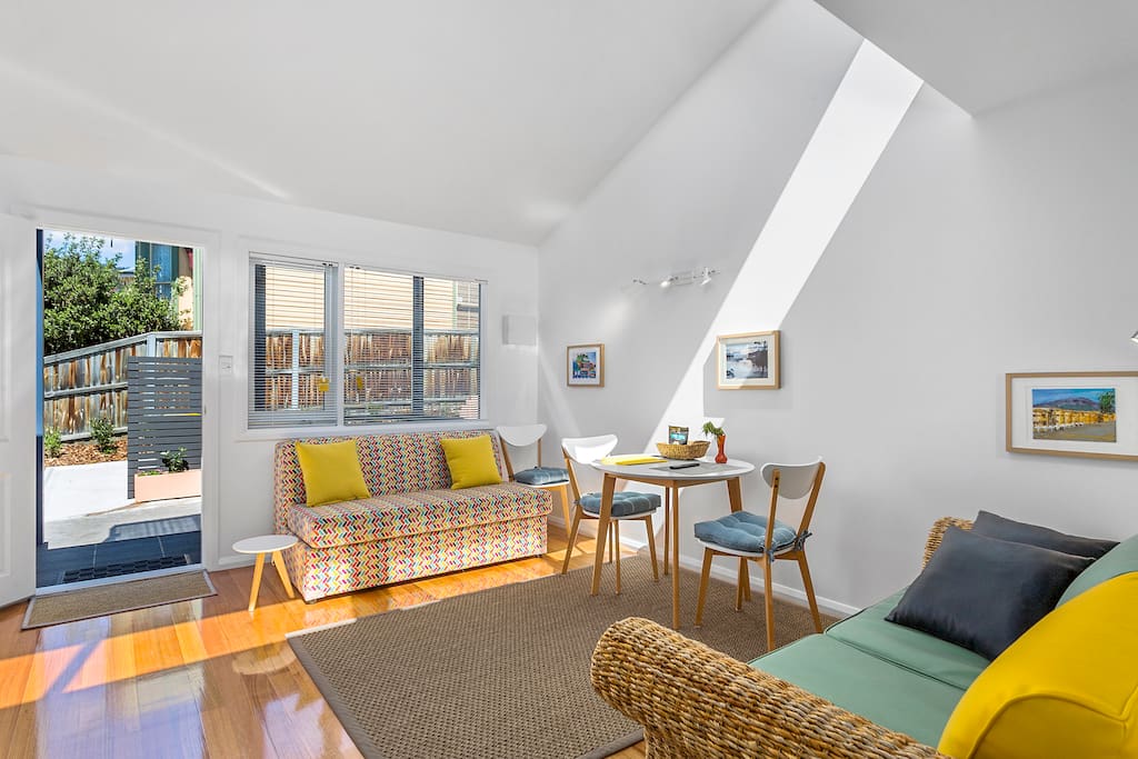 Bright and sunny outlook with raked ceiling, feature skylight and beautiful floors