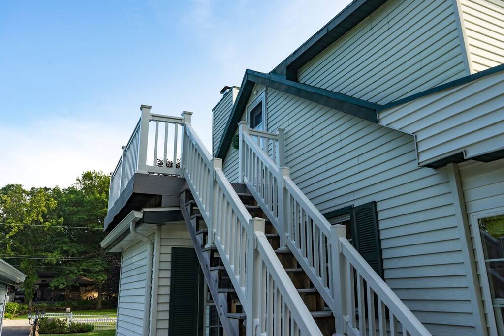 Stairs to private balcony & entrance.