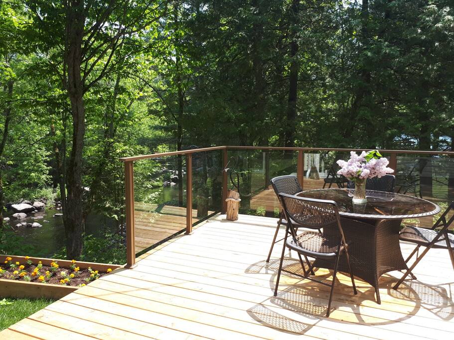 Private deck with views of Deer River. Relax and enjoy nature.