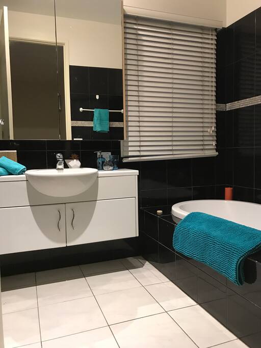 Sharring Bathroom has Bath tub, Shower, Toilet.