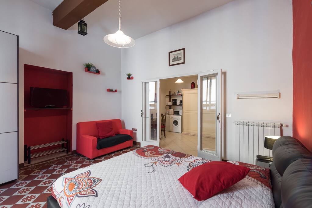 bedroom with king size bed and a single couch bed