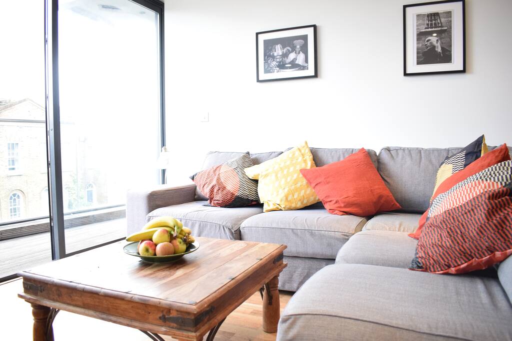 Living room incorporates a sofa bed.