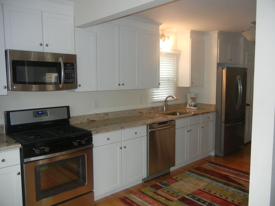 New, updated kitchen with stainless steel appliances and granite counters.