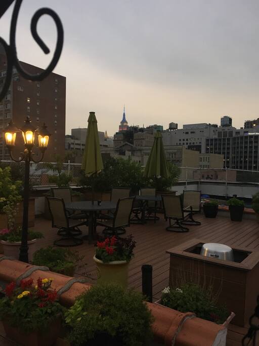 Shared roof deck with views of the Empire State Building